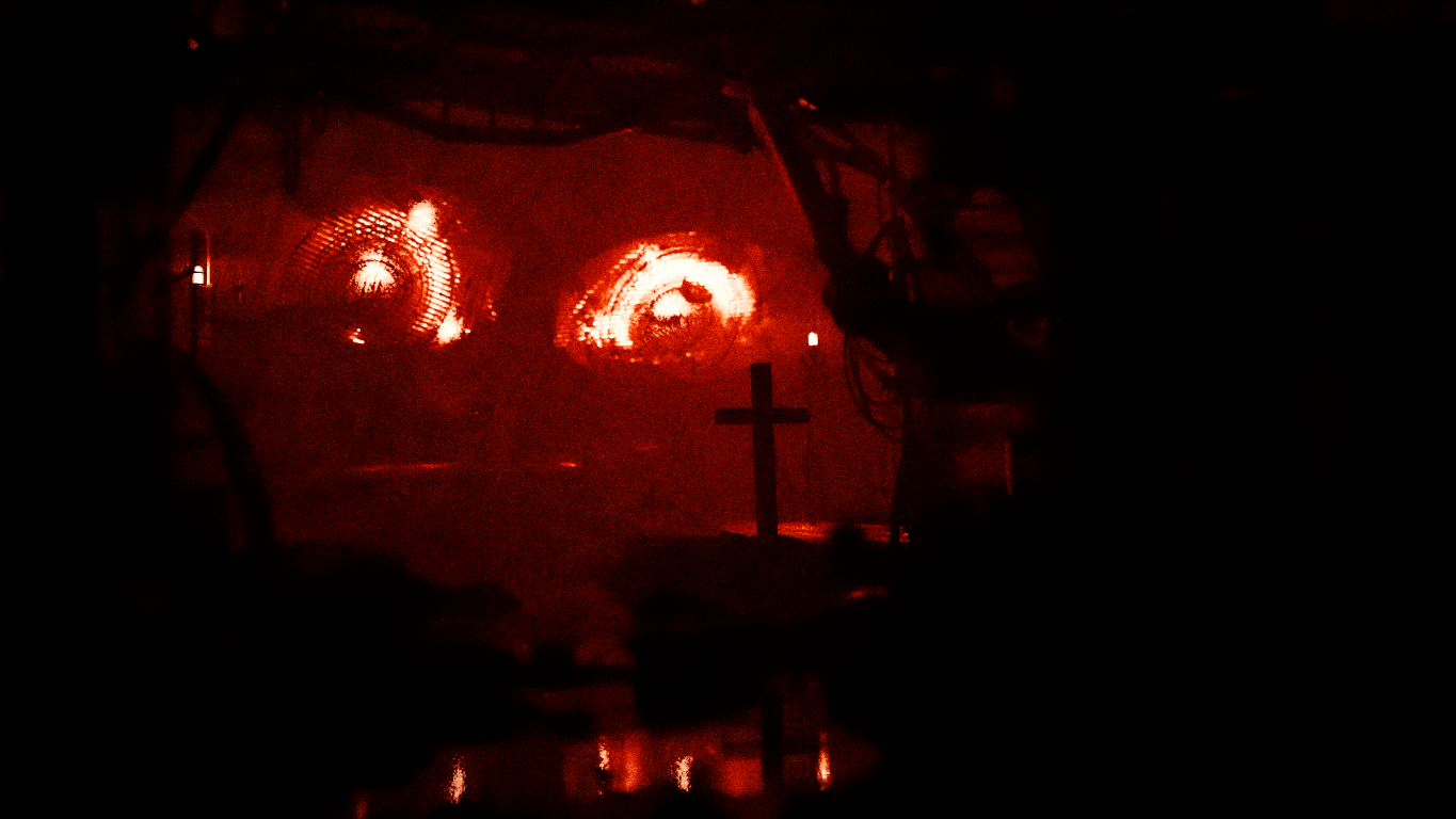 A dark, atmospheric landscape in shades of red